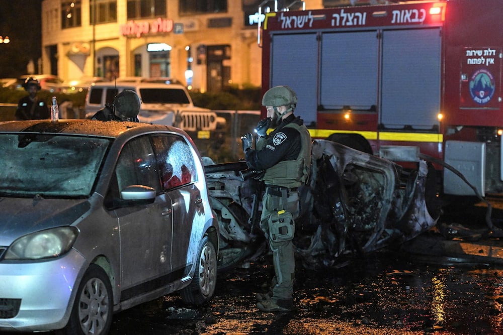 Israeli police investigate the scene of a rocket attack from Lebanon in Kiryat Shmona settlement, Occupied Palestine, Thursday, Nov. 2, 2023.(AP)