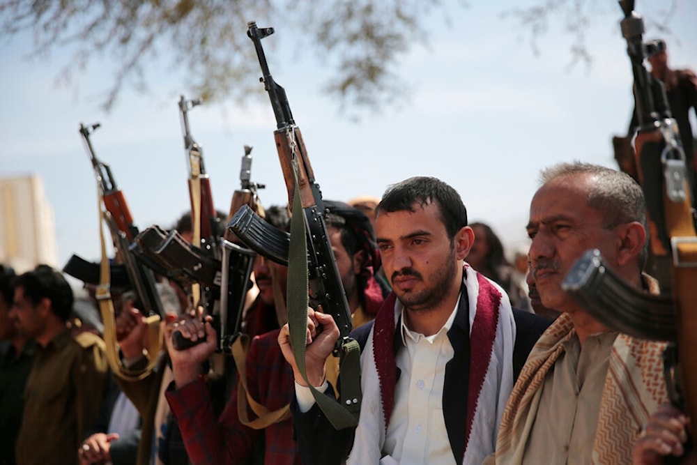 Armed Ansar Allah fighters attend the funeral procession of Yemeni Armed Forces fighters who were killed in recent fighting with Saudi-backed forces, in Sanaa, Yemen, November 24, 2021 (AP)