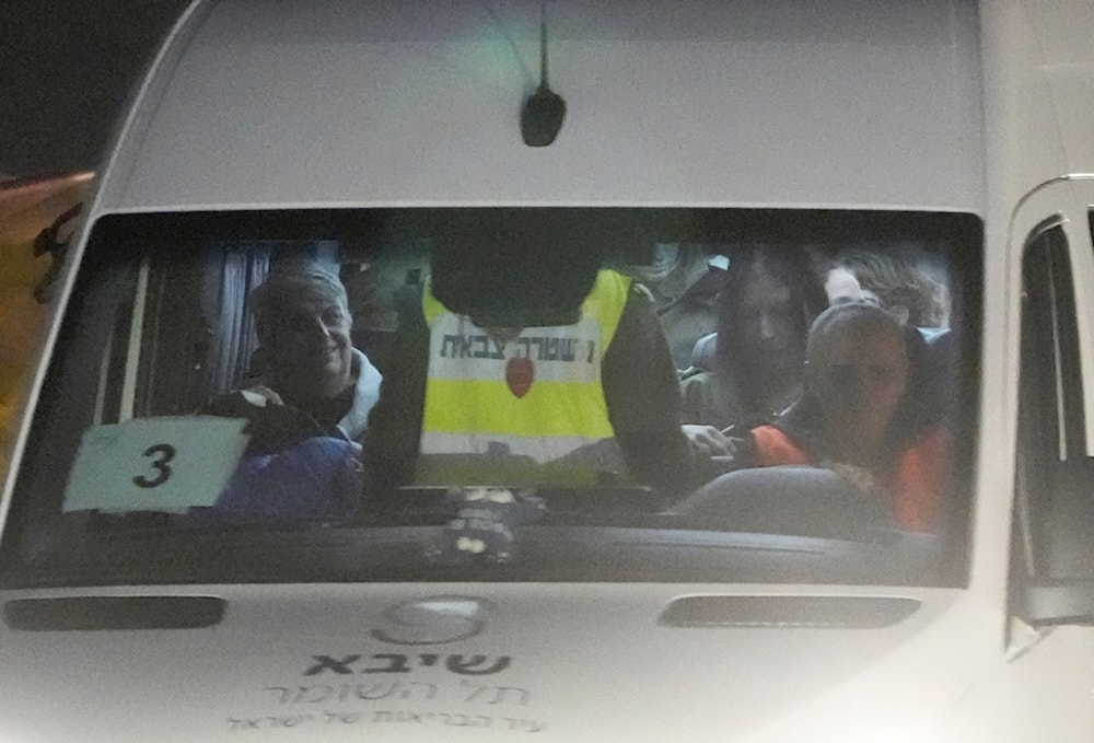  A mini-bus carrying Israeli hostages released by Hamas arrives at the at Sheba Medical Center in Ramat Gan, Israel, Tuesday, Nov. 28, 2023. 