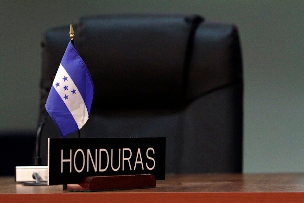 A Honduran flag is seen at the site where the next OAS General Assembly will take place in San Salvador, El Salvador, Wednesday, June 1, 2011. (AP)
