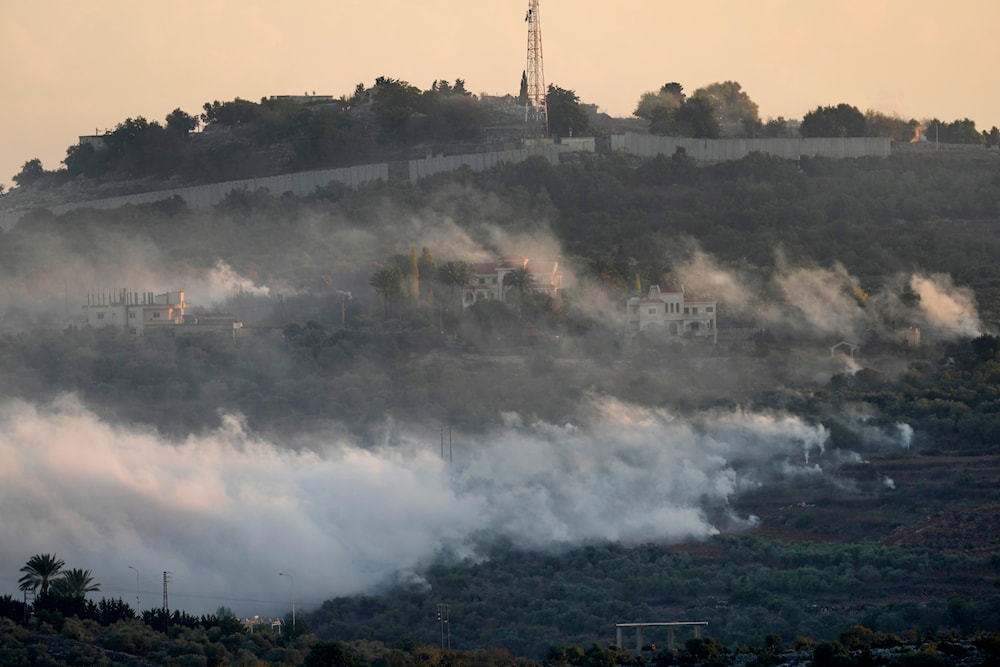 Smoke rises from Israeli artillery shelling in Dahaira, a Lebanese border village with Israel, south Lebanon, as one of the Israeli army positions which attacked by Hezbollah fighters seen on the top background, Monday, Oct. 16, 2023. (AP)