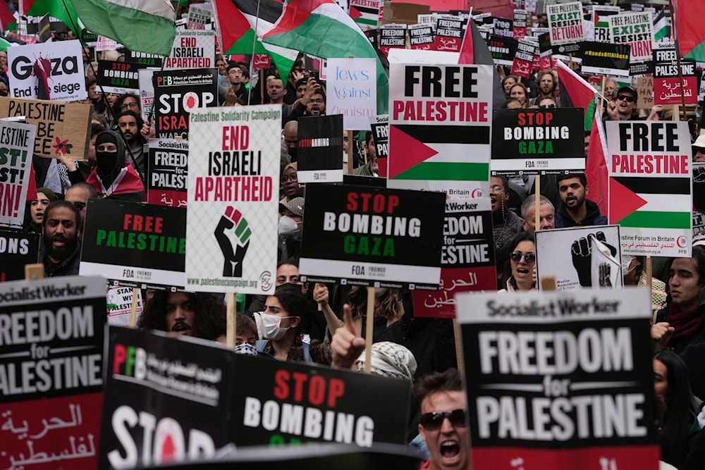 Protesters attend a pro Palestinian demonstration in London, Saturday, Oct. 14, 2023 (AP)