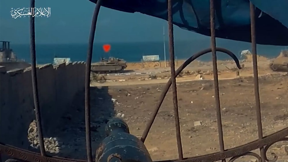 Screen Grab from a video published by the military media of the Palestinian Resistance, Al-Qassam Brigades, depicting the destruction of an Israeli Namer APC, posted on November 4, 2023 (Military Media)