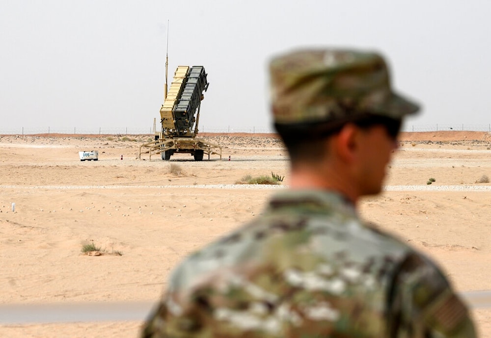 A member of the US Air Force stands near a Patriot missile battery at Prince Sultan Air Base in Saudi Arabia, February 20, 2020 (AFP)