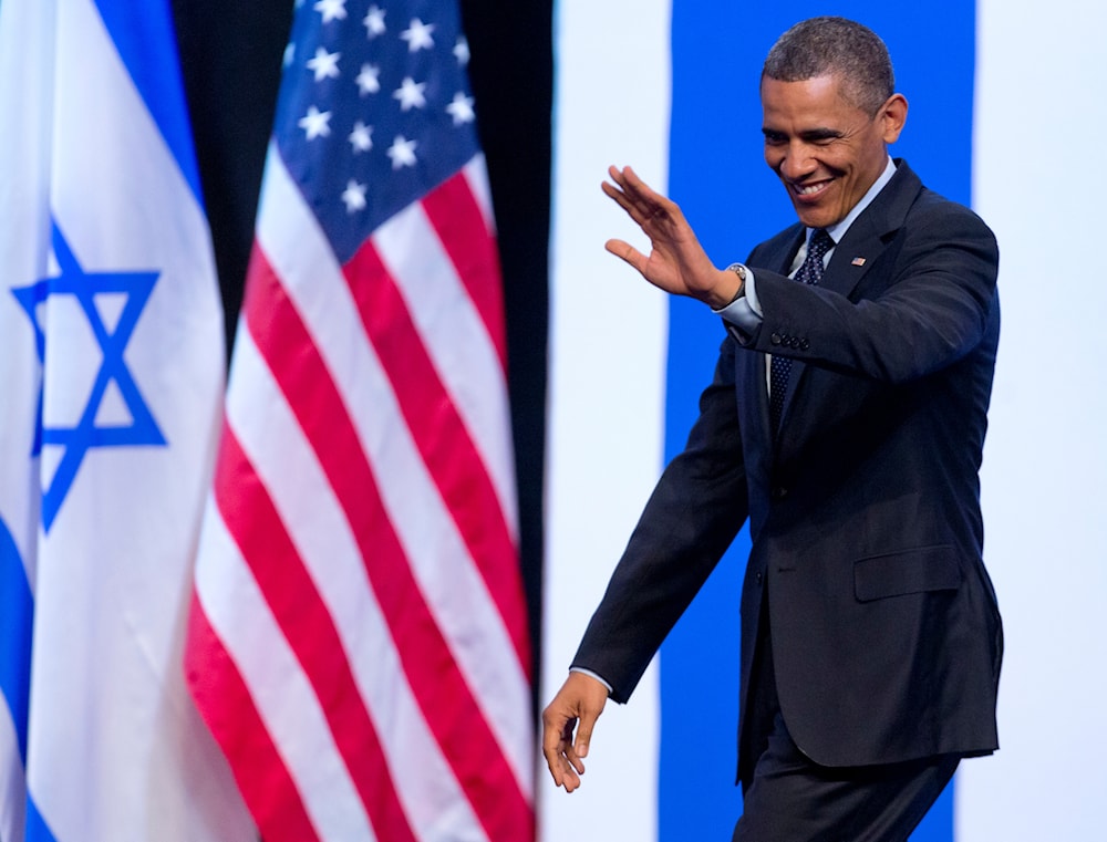President Barack Obama waves to the audience as he arrives to speak at the International Convention Center in occupied al-Quds, Thursday, March 21, 2013. (AP)