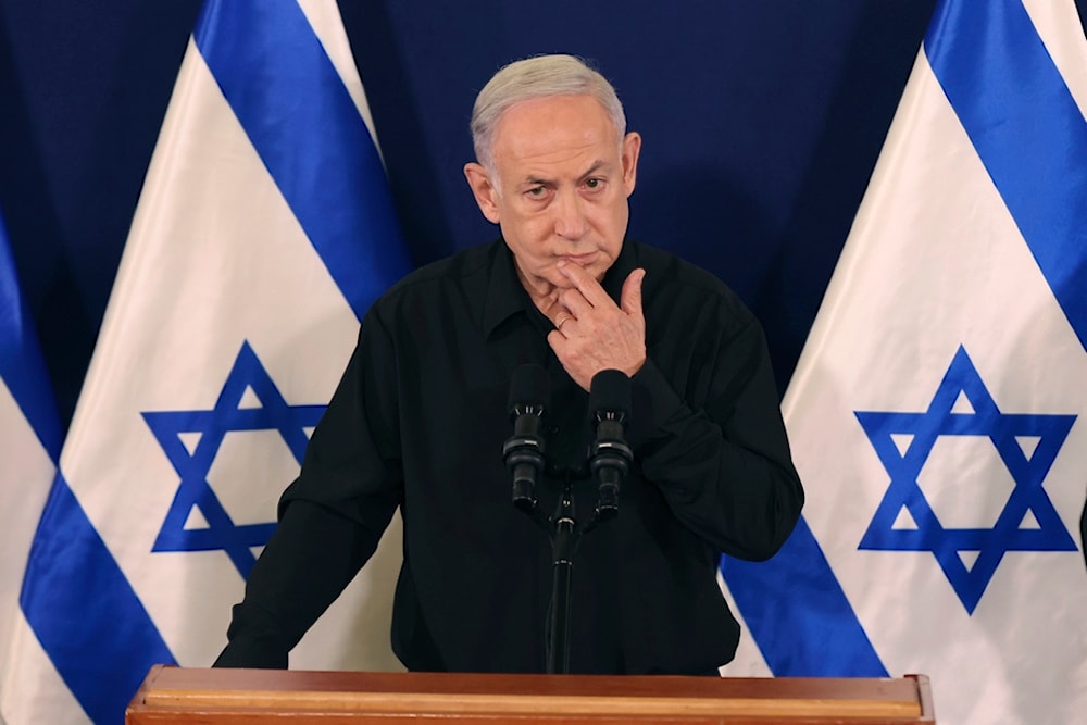 Israeli Prime Minister Benjamin Netanyahu speaks during a press conference with Security Minister Yoav Gallant and Cabinet Minister Benny Gantz in the Kirya military base in 'Tel Aviv', occupied Palestine, Oct. 28, 2023 (Pool Photo via AP)