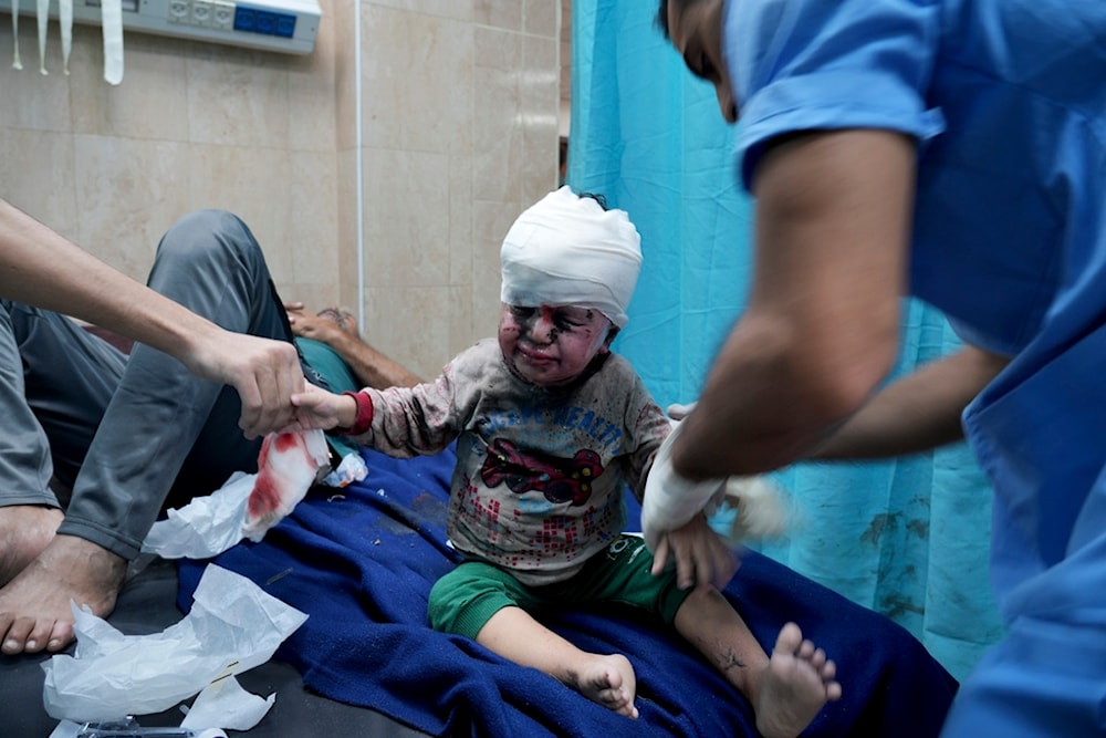 Palestinian child wounded in Israeli bombardment is treated in a hospital in Deir al Balah, south of the Gaza Strip, November 3, 2023 (AP)