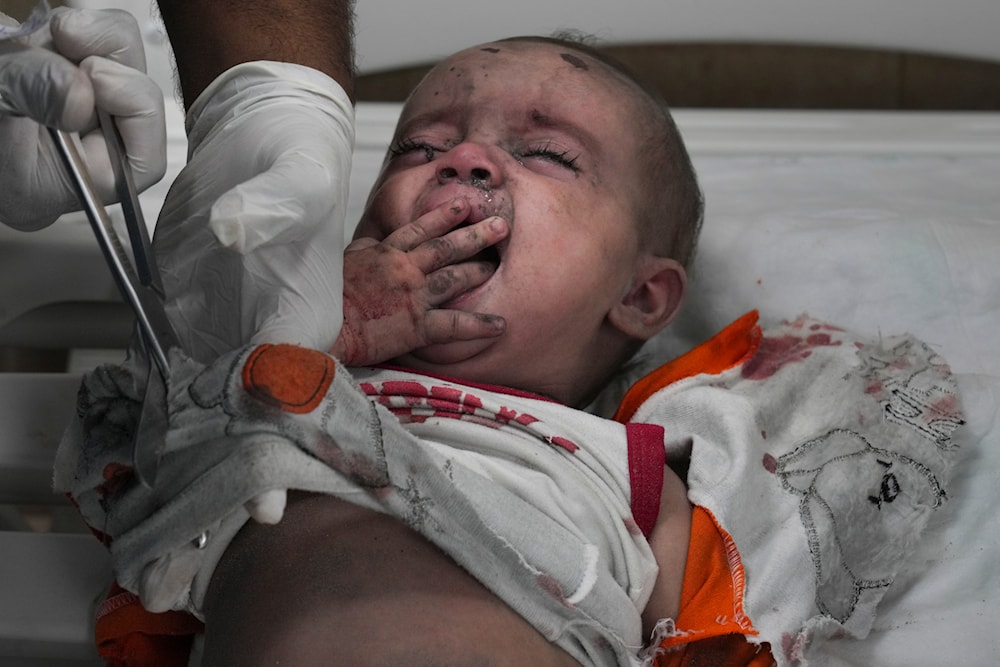 Palestinian child wounded in Israeli bombardment is treated in a hospital in Deir al Balah, south of the Gaza Strip on October 27, 2023. (AP)