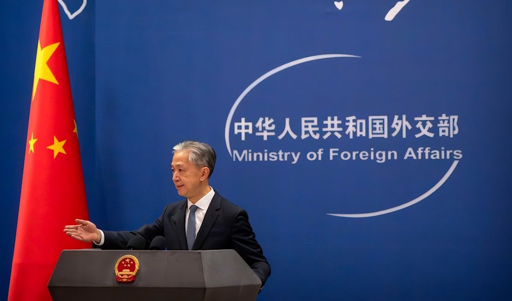 Chinese Foreign Ministry spokesperson Wang Wenbin gestures during a regular press conference in Beijing on May 9, 2023. (AP)