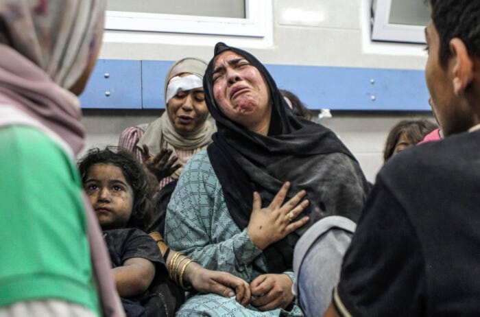 Women and children wounded in Israeli airstrike at al-Ahli Arab hospital, waiting to be treated at the al-Shifa hospital, in Gaza City, on October 17, 2023. (AP)