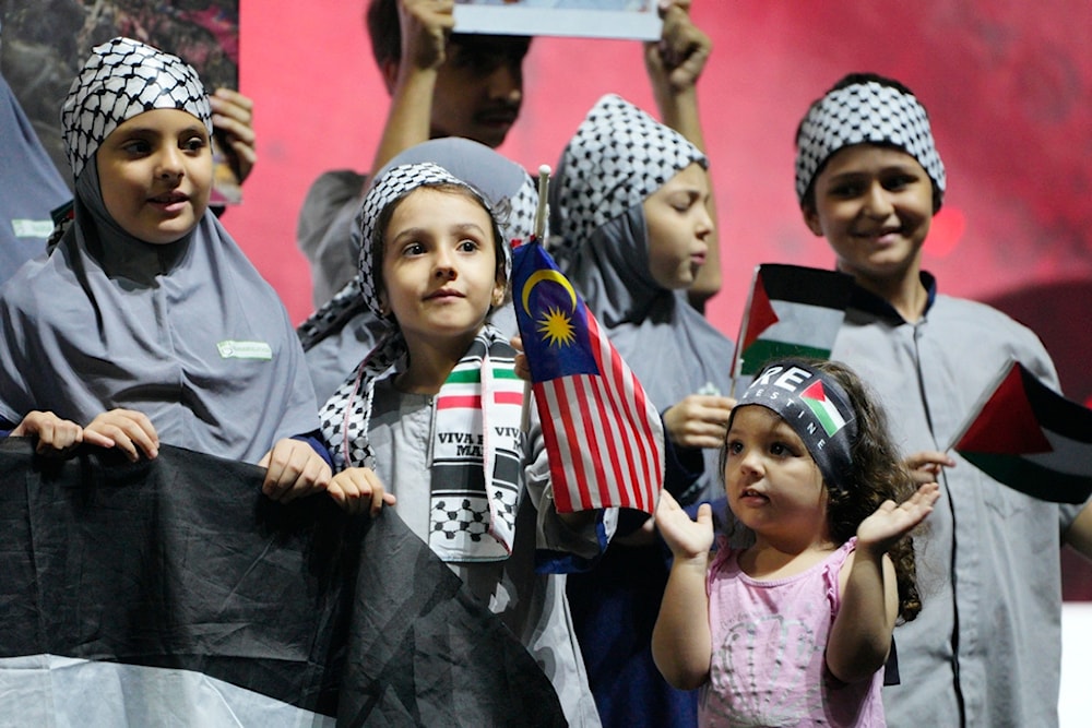 Palestinian children living in Malaysia attend a rally to show their support for the Palestinian people in Kuala Lumpur, Malaysia, Tuesday, Oct. 24, 2023. (AP)