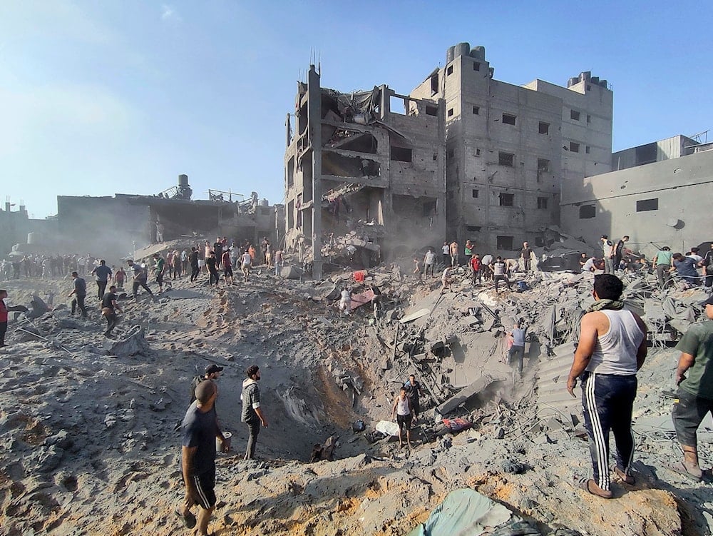  Palestinians inspect the damage of buildings destroyed by Israeli airstrikes on Jabaliya refugee camp on the outskirts of Gaza City on Oct. 31, 2023 (AP Photo/Abdul Qader Sabbah, File)