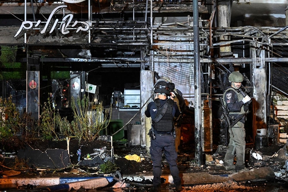 sraeli police investigate the scene of a rocket attack from Lebanon in 