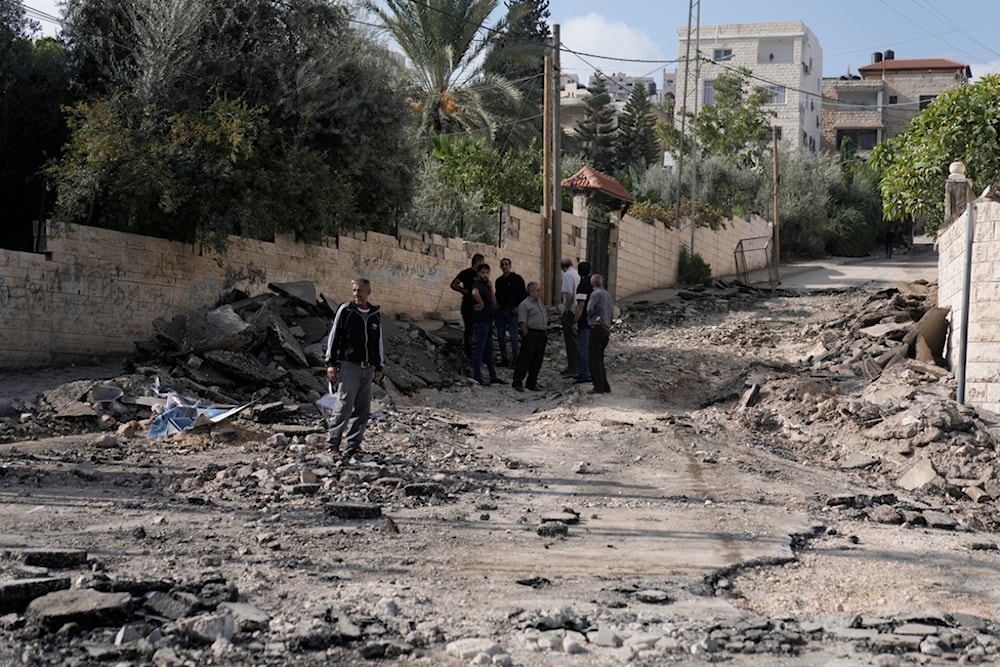 Palestinians look at the damage after a raid by the Israeli Occupation Forces on Jenin, occupied West Bank, occupied Palestine, Friday, Nov. 3, 2023. (AP)