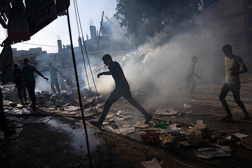 Palestinians look for survivors following an Israeli airstrike in Khan Younis refugee camp, southern Gaza Strip, Tuesday, Nov. 7, 2023. (AP Photo/Fatima Shbair)