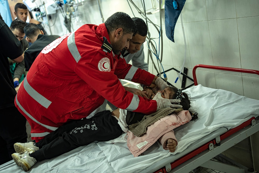 A Palestinian girl wounded in Israeli bombardment of the Gaza Strip is brought to a hospital in Khan Younis, Friday, Dec. 1, 2023. (AP)