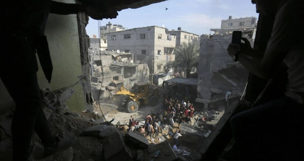 Palestinians look for survivors after an Israeli strike on the Gaza Strip in Rafah on October 30, 2023. (AP)