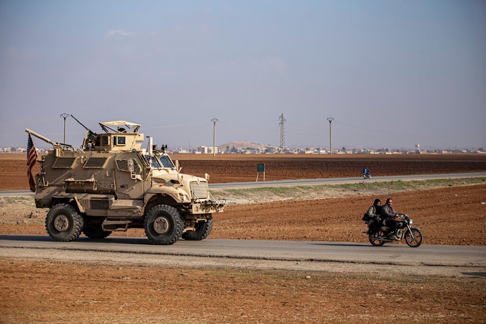 US military vehicle is seen on a patrol in the countryside near the town of Qamishli, Syria, Sunday, Dec. 4, 2022. (AP Photo/Baderkhan Ahmad)