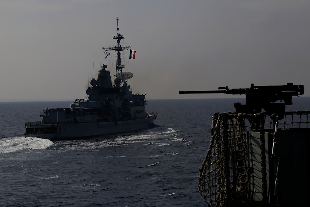 A France war ship, left, passes by the Royal Navy's flagship HMS Albion during naval drills between Britain, France and Cyprus off Limassol, Cyprus, on Tuesday, Oct. 27, 2020. (AP)