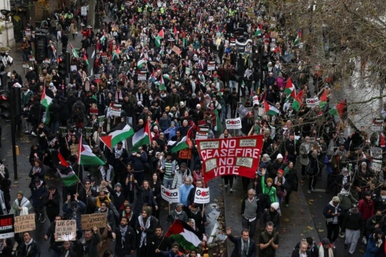 People take part in a protest in solidarity with the Palestine, in London, December 9, 2023 (Hollie Adams/Reuters)