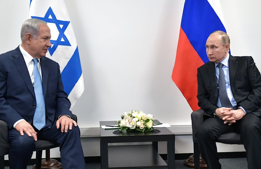 Russian President Vladimir Putin listens to Israeli Prime Minister Benjamin Netanyahu during their meeting at the Jewish Museum in Moscow, Russia, Monday, Jan. 29, 2018 (AP)