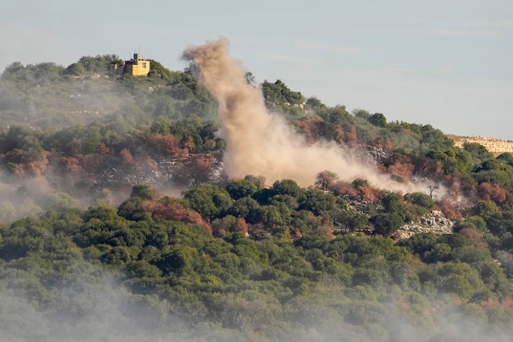 Smoke rises from Israeli artillery shelling on the outskirts of Yaroun, a Lebanese border village, in south Lebanon, Sunday, Dec. 10, 2023 (AP Photo/Hassan Ammar)