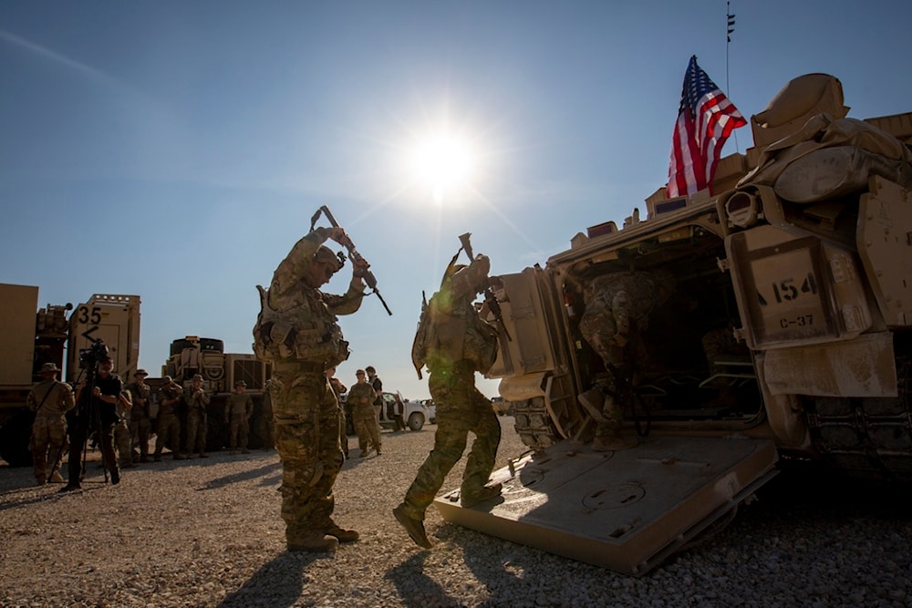 Crewmen enter Bradley fighting vehicles at a US military base in Northeastern Syria, on Nov. 11, 2019 (AP)