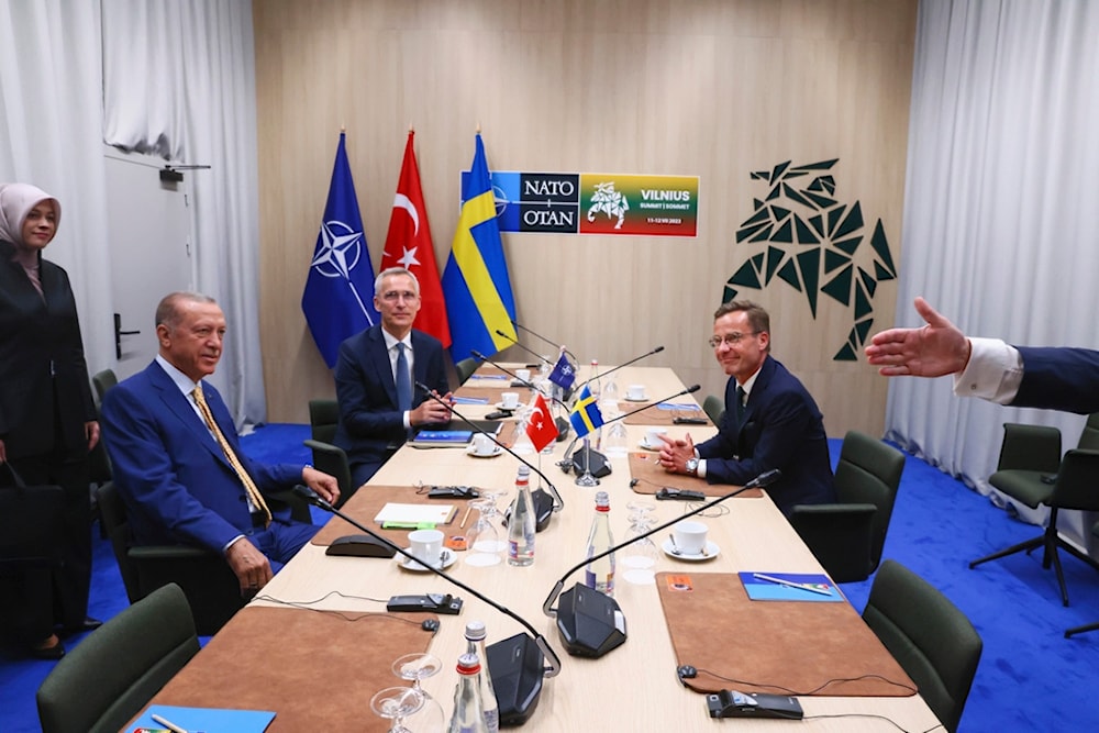  NATO Secretary General Jens Stoltenberg, center, Turkish President Recep Tayyip Erdogan, left, and Sweden's Prime Minister Ulf Kristersson, right, during a meeting ahead of a NATO summit in Vilnius, Lithuania, on July 10, 2023 (AP)