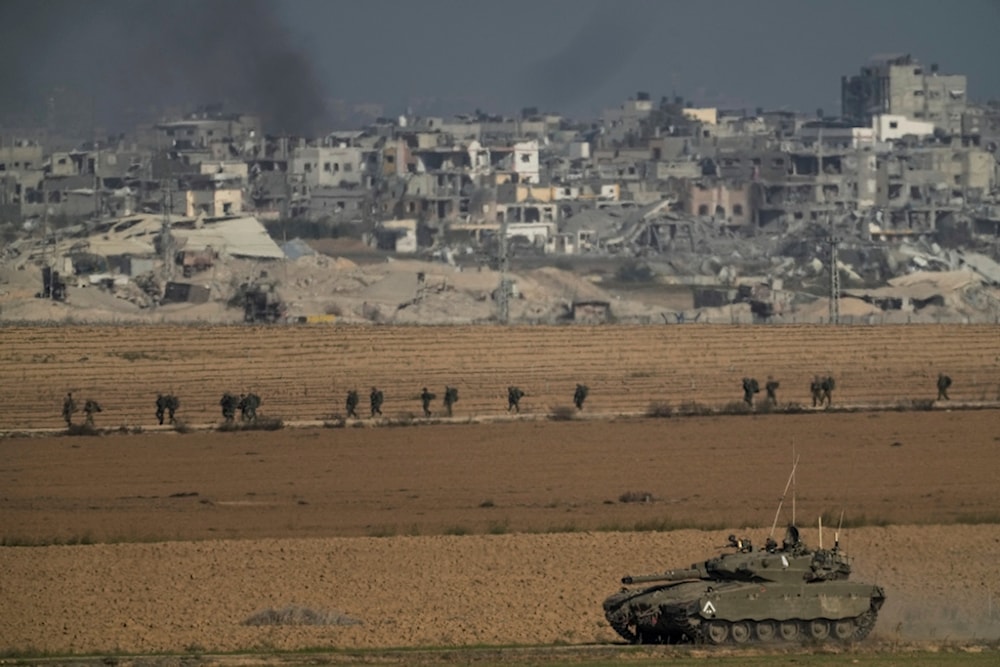 Israeli troops are seen near the Gaza Strip border, Occupied Palestine on Sunday, Dec. 10, 2023. (AP)