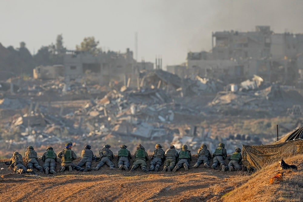 Israeli occupation soldiers take positions near the Gaza Strip border, occupied Palestine, Monday, Dec. 11, 2023. (AP)