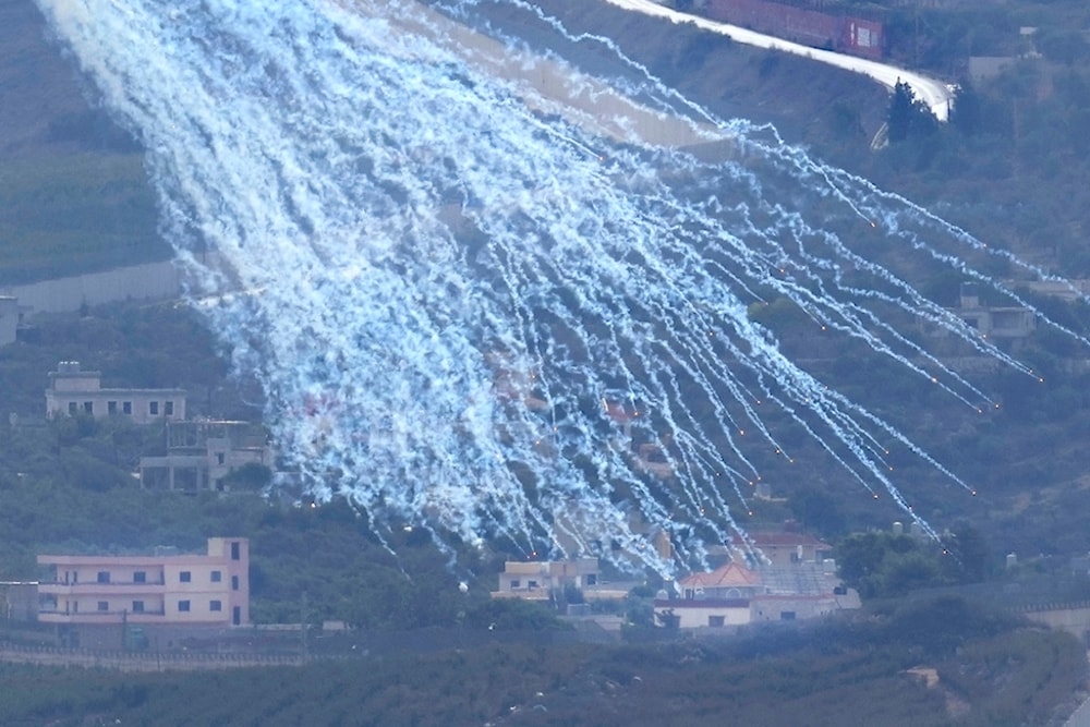A shell that appears to be white phosphorus from Israeli artillery explodes over Kfar Kila, a Lebanese border village with Israel, as it seen from Marjayoun town in south Lebanon, Wednesday, Nov. 22, 2023 (AP Photo/Hussein Malla)