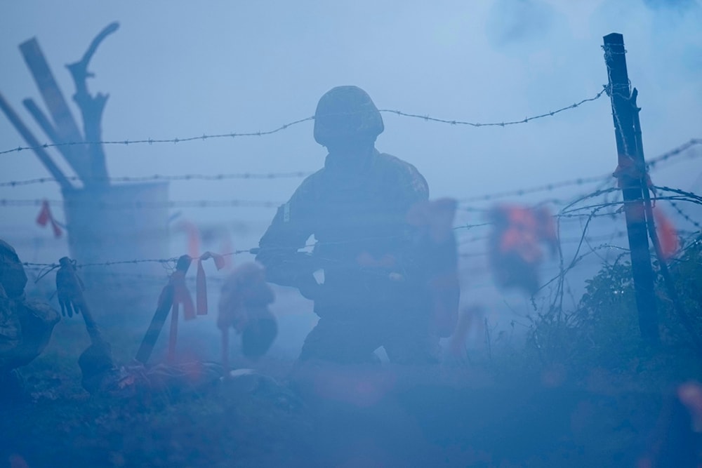 Ukrainian soldiers practice during a visit of Swedish Crown Princess Victoria and Prince Daniel to the STANTA training camp in East Anglia, England, Wednesday, Nov. 29, 2023. (AP)