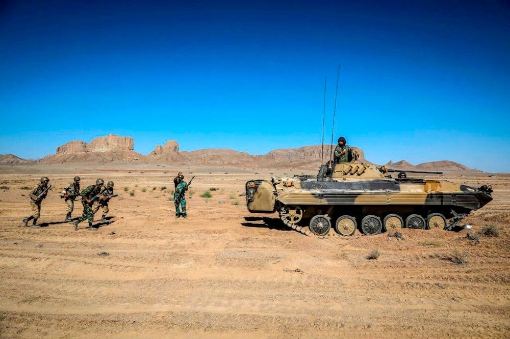 In this picture released by the official website of the Iranian Army on Thursday, Sept. 8, 2022, troops attend a ground forces maneuver in central Iran (AP)