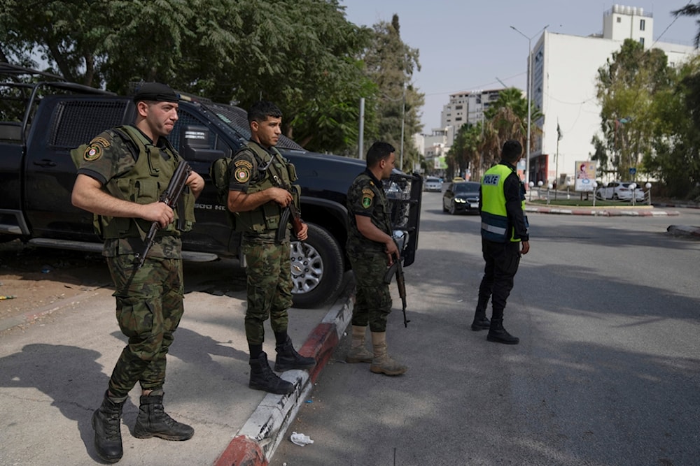 Palestinian security forces newly deployed in the city of Jenin are seen stationed at main junctions in the occupied West Bank city of Jenin, occupied Palestine, August 13, 2023 (AP)