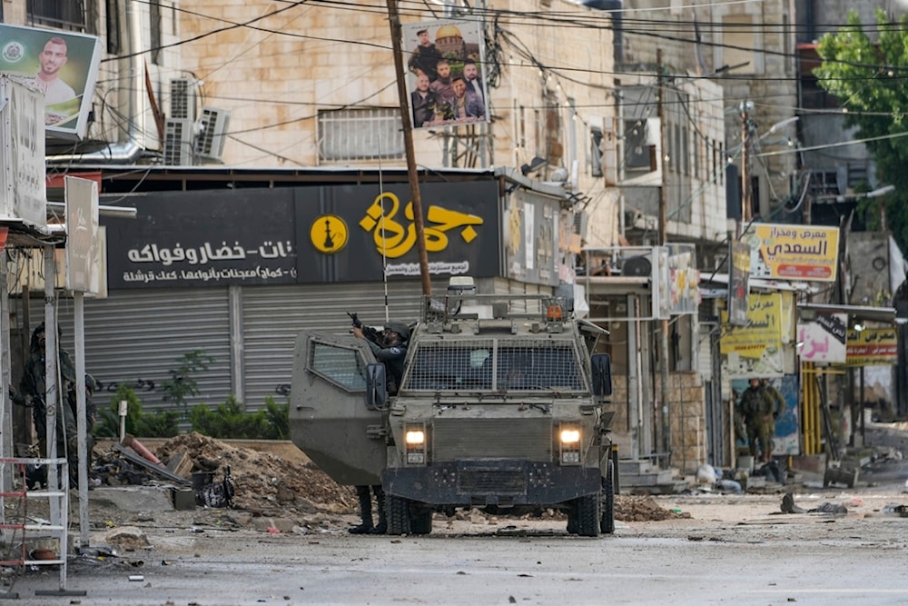 Israeli occupation soldiers are seen during a raid on Jenin, the occupied West Bank, occupied Palestine, December 13, 2023 (AP)