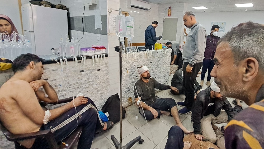 Wounded Palestinians wait at Kamal Adwan Hospital in Beit Lahia following Israeli airstrike on Nov. 21, 2023. (AFP)
