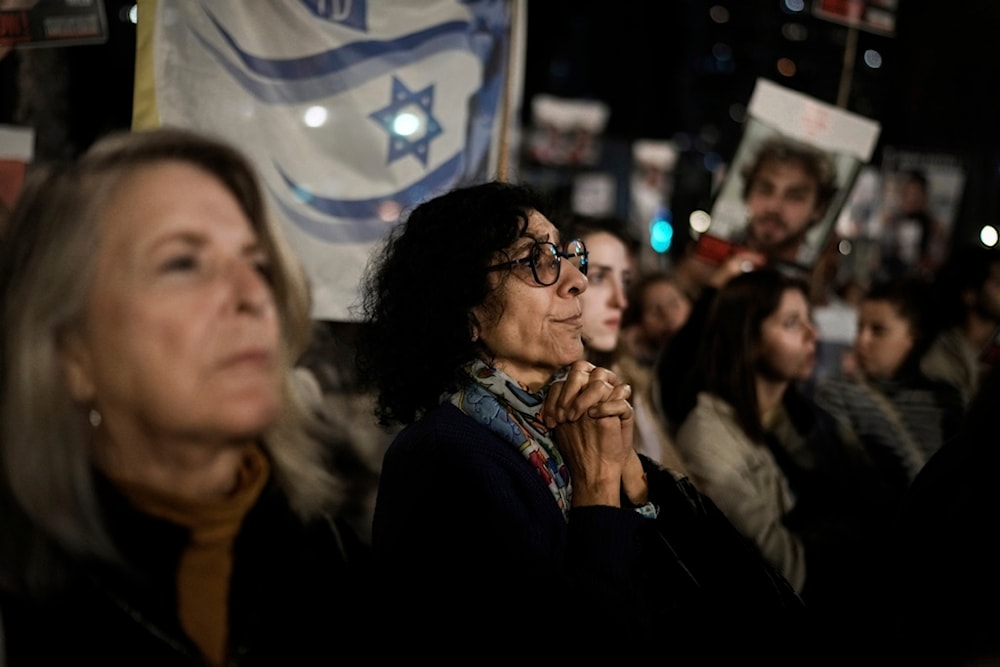 Families of Israeli captives held by the Palestinian Resistance in Gaza attend a rally calling for their release, in 'Tel Aviv', occupied Palestine, December 16, 2023 (AP)