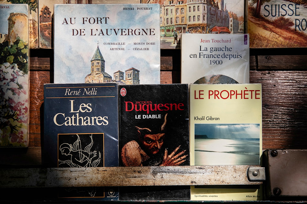 Books are displayed at a bookseller booth in Paris, Tuesday, Aug. 22, 2023. (AP)