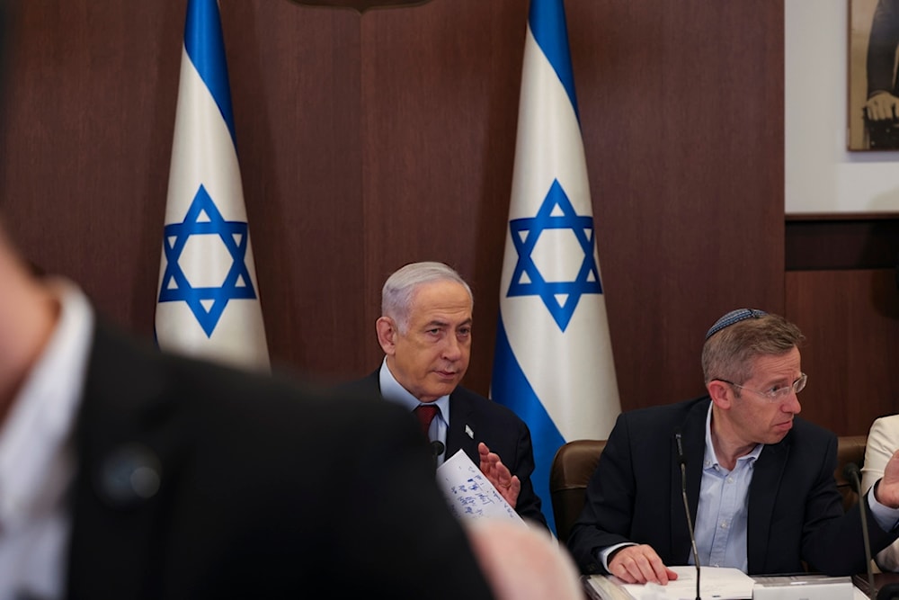 Israeli Prime Minister Benjamin Netanyahu attends the weekly cabinet meeting at the Prime Minister's office in occupied al-Quds, occupied Palestine December 10, 2023 (AP)