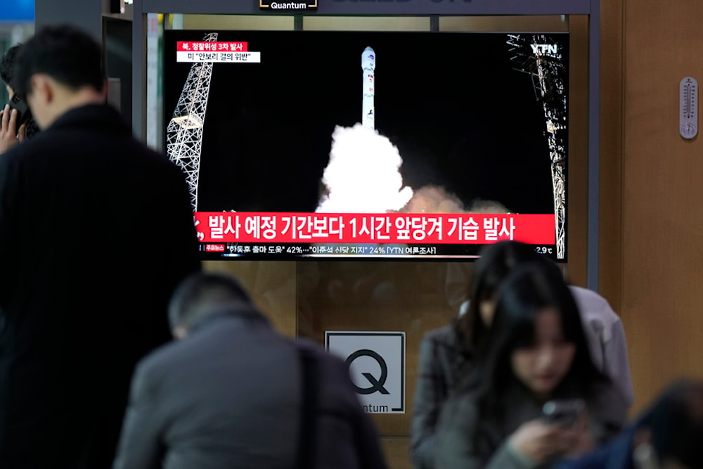 A TV screen shows a report of DPRK's a spy satellite into orbit with its third launch attempt this year, during a news program at the Seoul Railway Station in Seoul, South Korea, Nov. 22, 2023. 