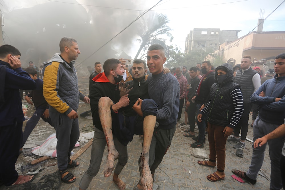 Palestinians evacuate survivors of an Israeli strike in Rafah, Gaza Strip, Thursday, Dec. 14, 2023. (AP)