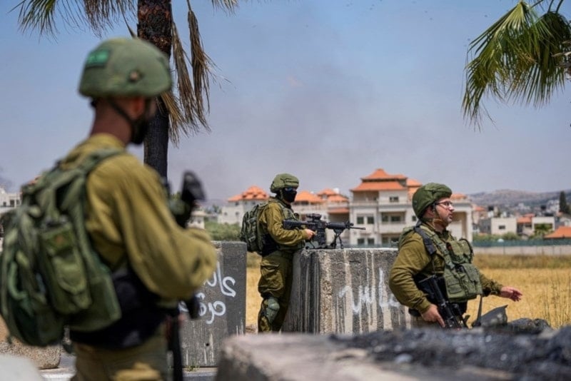 Israeli soldiers are at the entrance of the west bank on June 21, 2023 (AP)