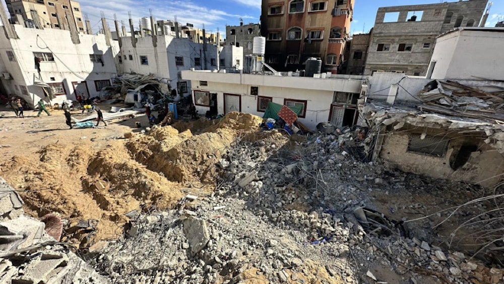 Israeli forces reportedly bulldozed parts of Kamal Adwan Hospital, burying alive and killing Palestinians. (AP)