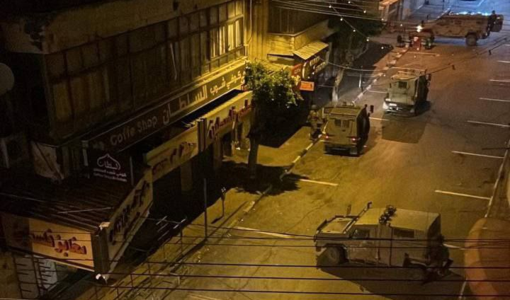 An image showing Israeli occupation forces raiding Palestine Street leading up to Martyr's Roundabout in central Nablus, West Bank, in occupied Palestine, overnight on December 18, 2023. (Social media)