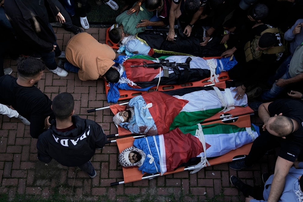 Friends and relatives attend the funeral of Palestinians killed during an Israeli raid on the Fara refugee camp in the occupied West Bank, occupied Palestine, December 18, 2023 (AP)
