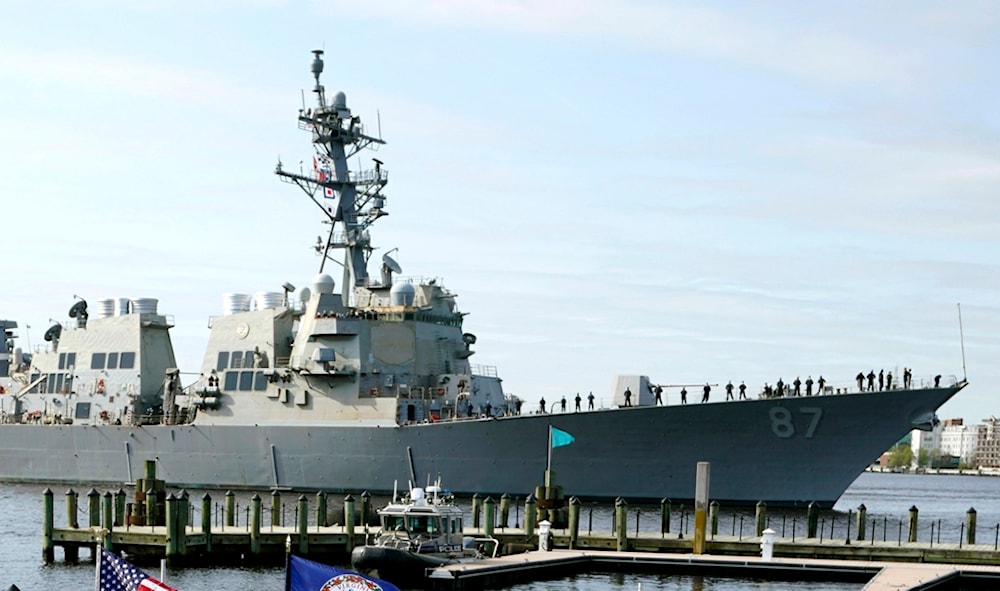 The USS Mason, an Arleigh Burke-class destroyer, passes a dock in Norfolk, Virginia, April 8, 2021 (AP)
