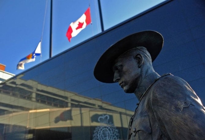 Flags of Nova Scotia and Canada fly at half-staff outside the Nova Scotia Royal Canadian Mounted Police (RCMP) headquarters in Dartmouth, Nova Scotia, Canada (AFP)