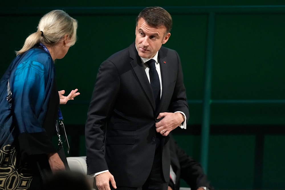 France President Emmanuel Macron attends a plenary session at the COP28 U.N. Climate Summit, Friday, Dec. 1, 2023, in Dubai, United Arab Emirates. (AP)