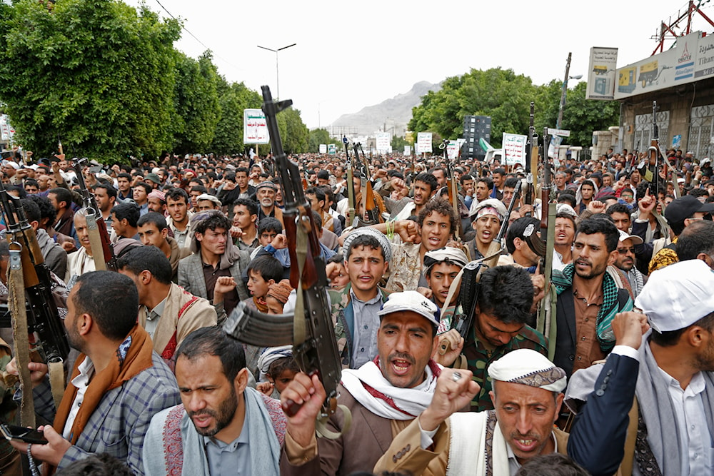 Houthi supporters chant slogans as they attend a rally marking eight years for a Saudi-led coalition, on March 26, 2023, in Sanaa, Yemen. (AP)
