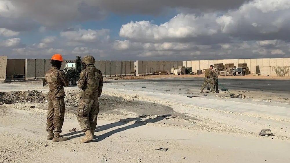 A picture taken on January 13, 2020 during a press tour organised by the US-led coalition fighting the remnants of the ISIS group, shows US soldiers clearing rubble at Ain al-Asad military airbase in the western Iraqi province of Anbar. (AFP)